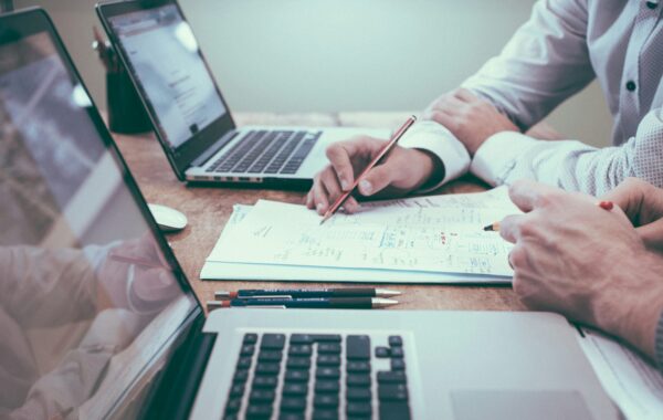 People at computers planning professional business valuation