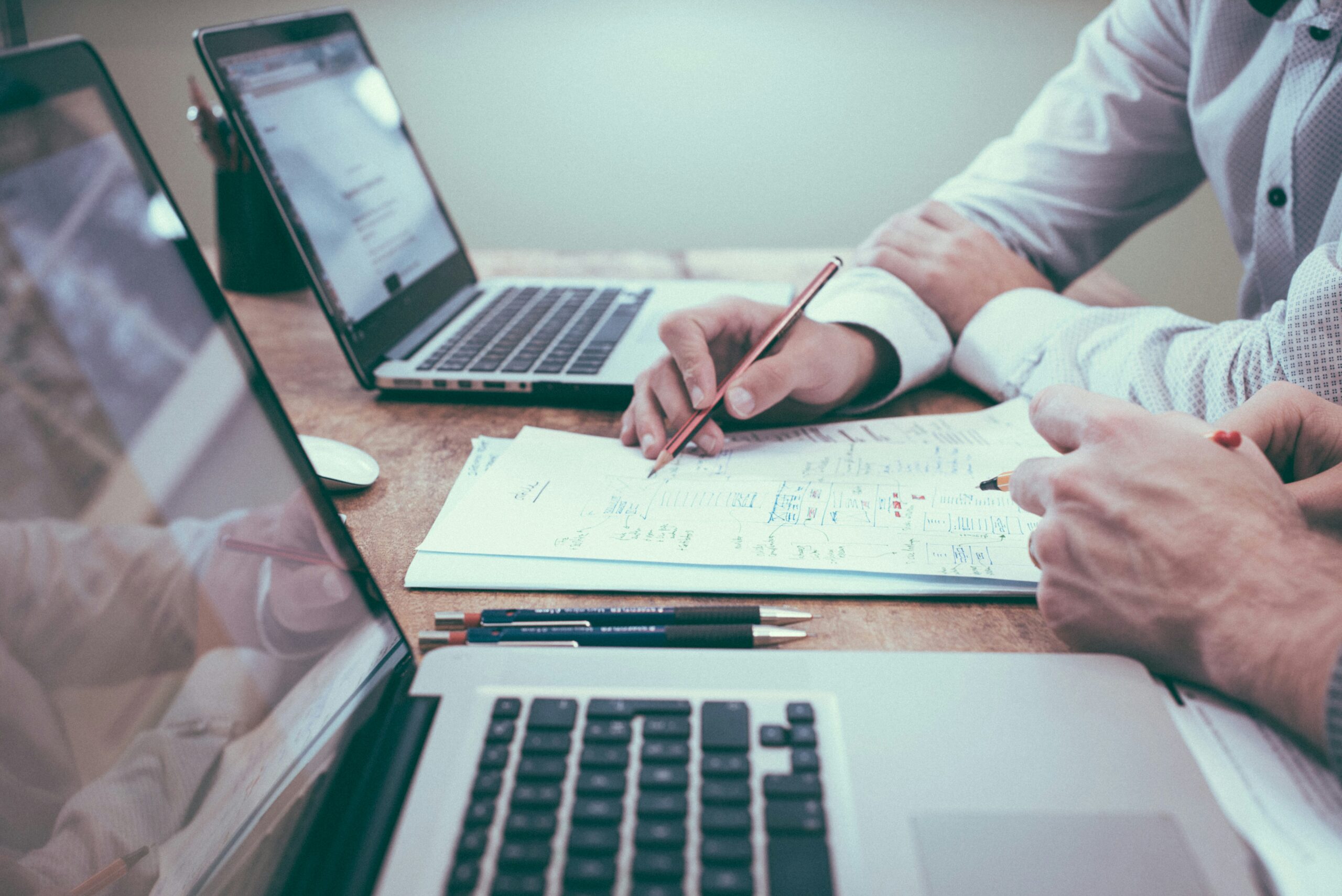 People at computers planning professional business valuation