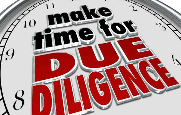 Clock face with the words 'Make Time for Due Diligence' in bold red letters
