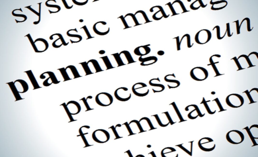 Close-up of a dictionary definition for the word 'planning'